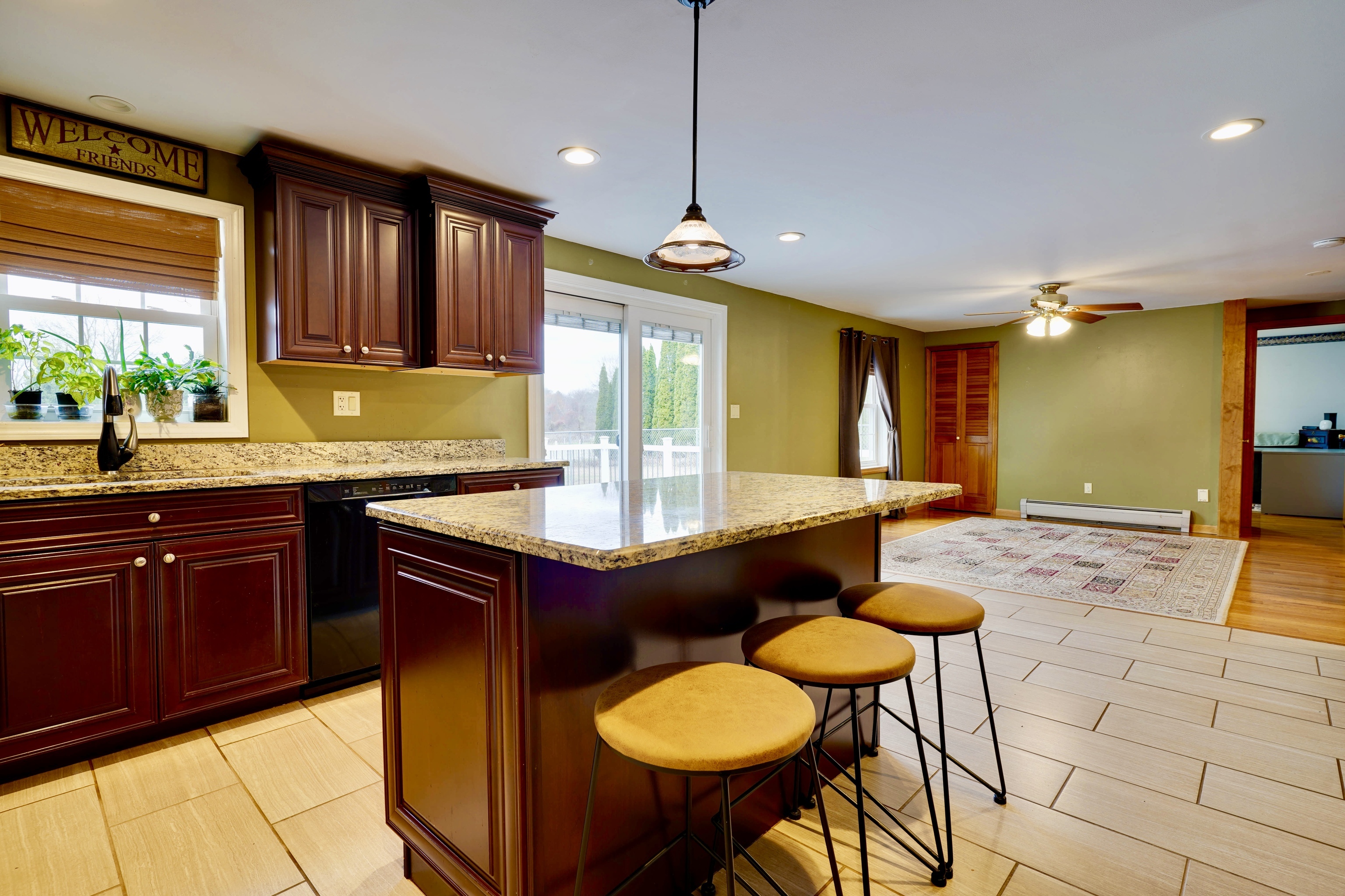 85 Bailey Woods Road Brooklyn, CT 06234 - Photo 5 of 35 a kitchen with stainless steel appliances granite countertop a sink and a wooden cabinets