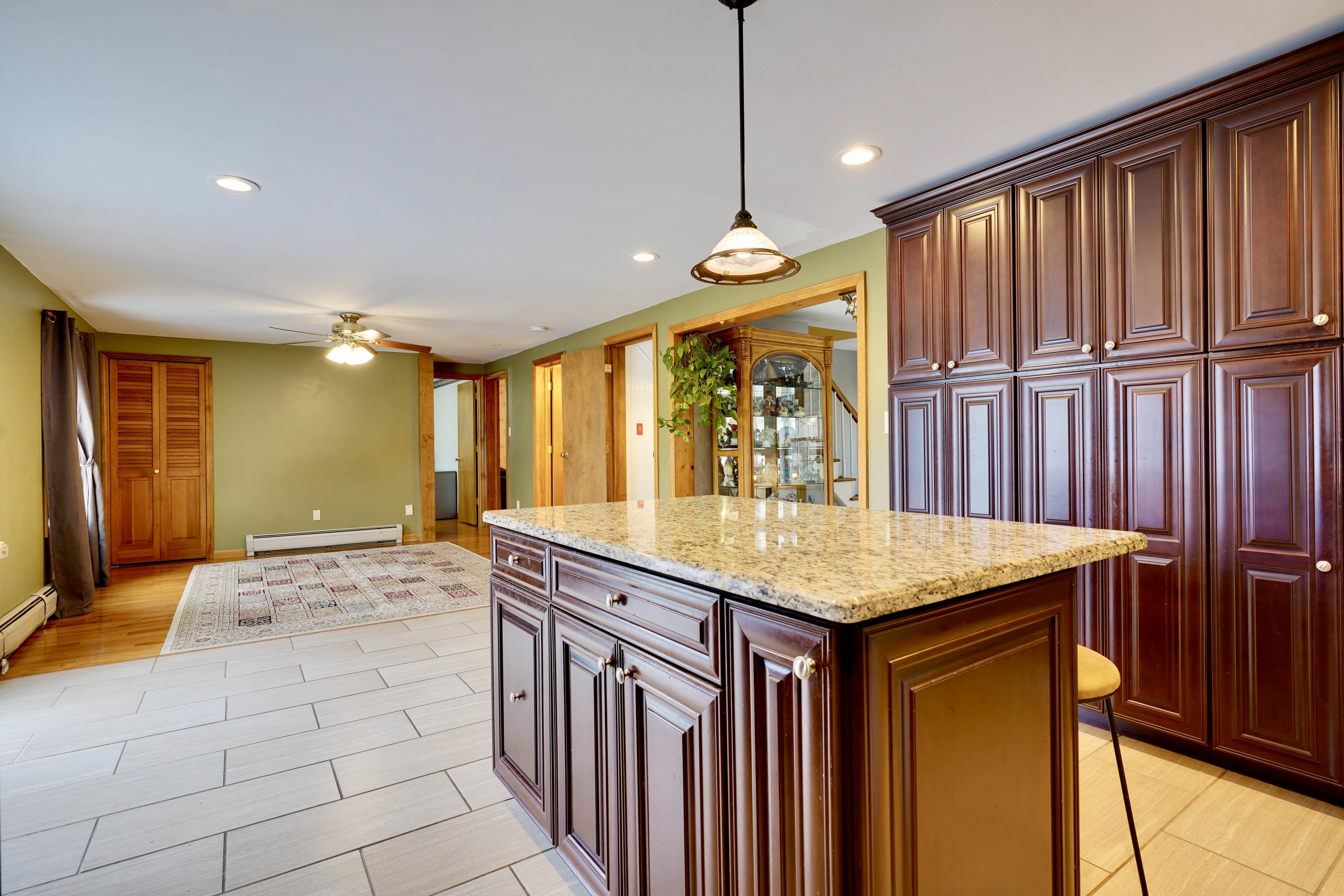 85 Bailey Woods Road Brooklyn, CT 06234 - Photo 6 of 35 a kitchen with stainless steel appliances granite countertop a sink a stove cabinets and a dining table