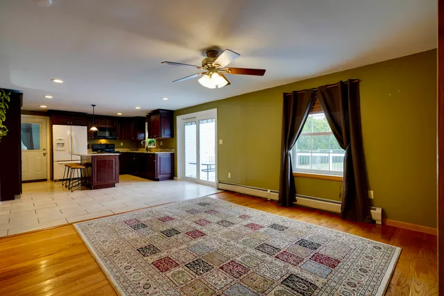 a view of a livingroom with furniture and a rug