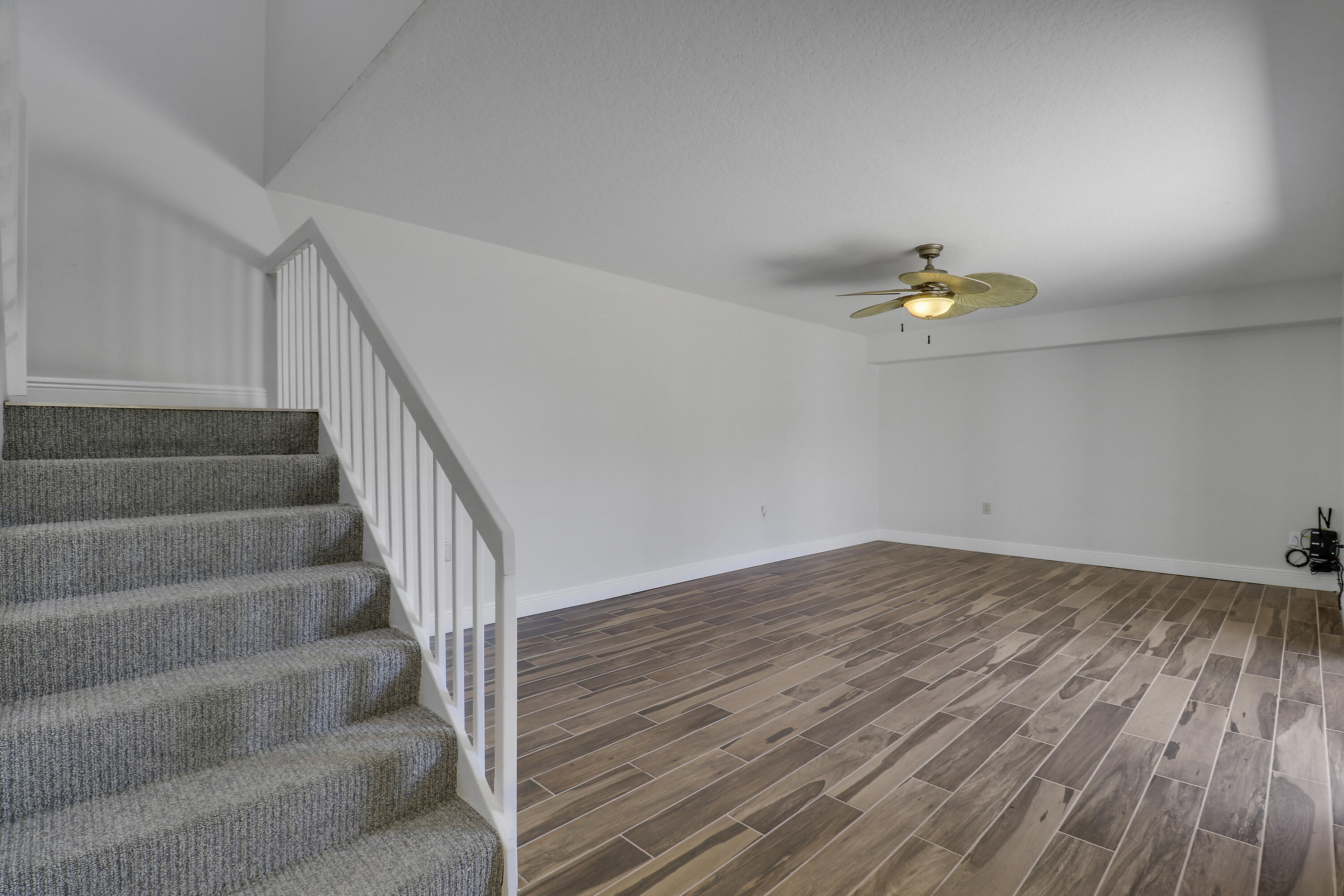 2324 23rd Court, Unit 55D Jupiter, FL 33477 - Photo 14 of 41 a view of an empty room with stairs