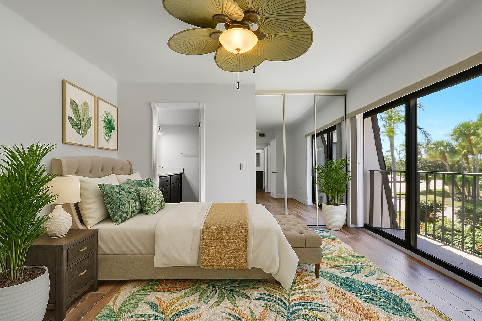 2324 23rd Court, Unit 55D Jupiter, FL 33477 - Photo 16 of 41 a bedroom with a bed mirror and window