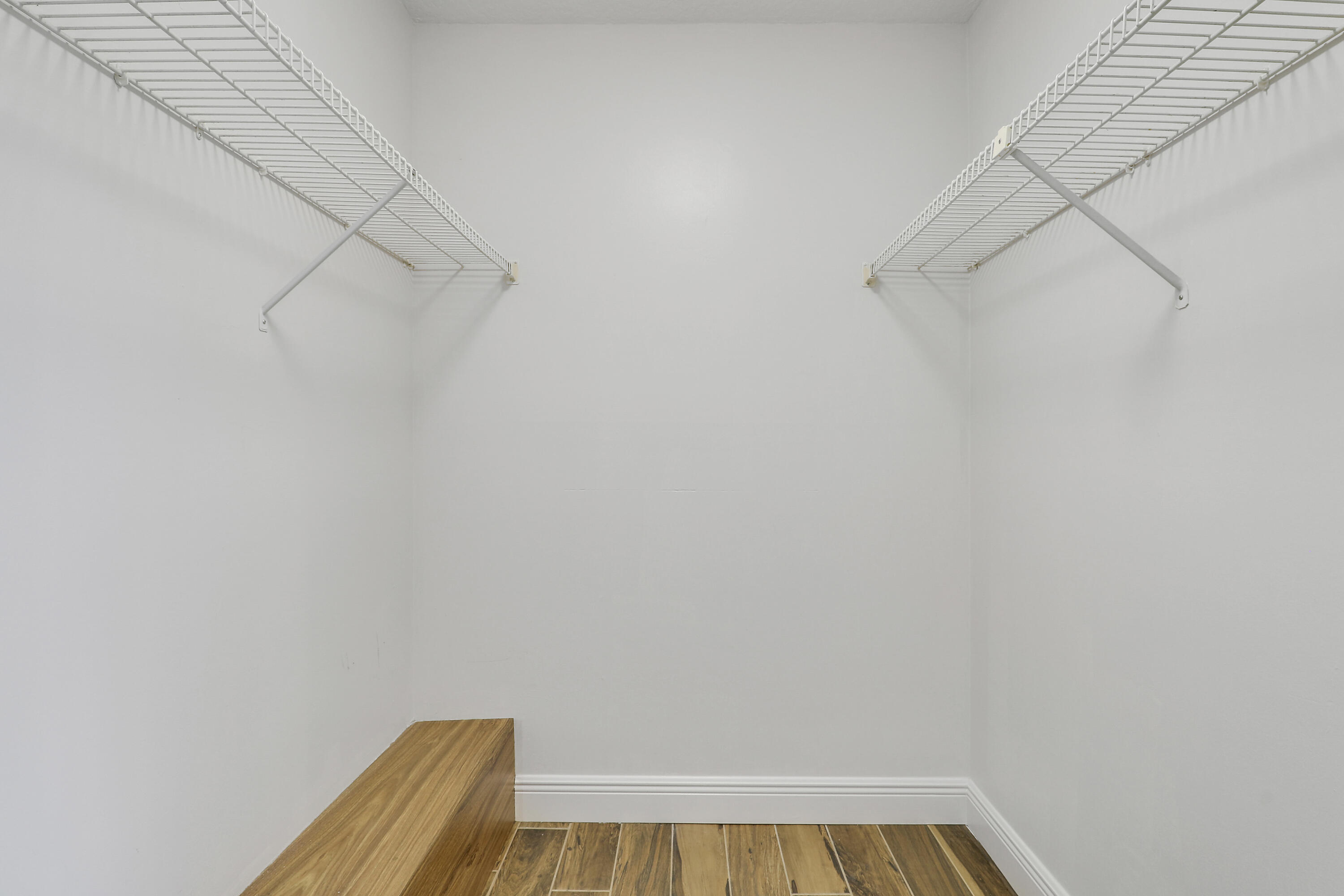 2324 23rd Court, Unit 55D Jupiter, FL 33477 - Photo 19 of 41 a view of a room with racks on the wall