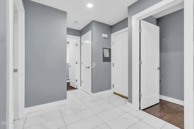 a view of a hallway with closet area