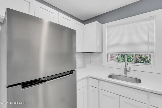 a kitchen with a sink and a window