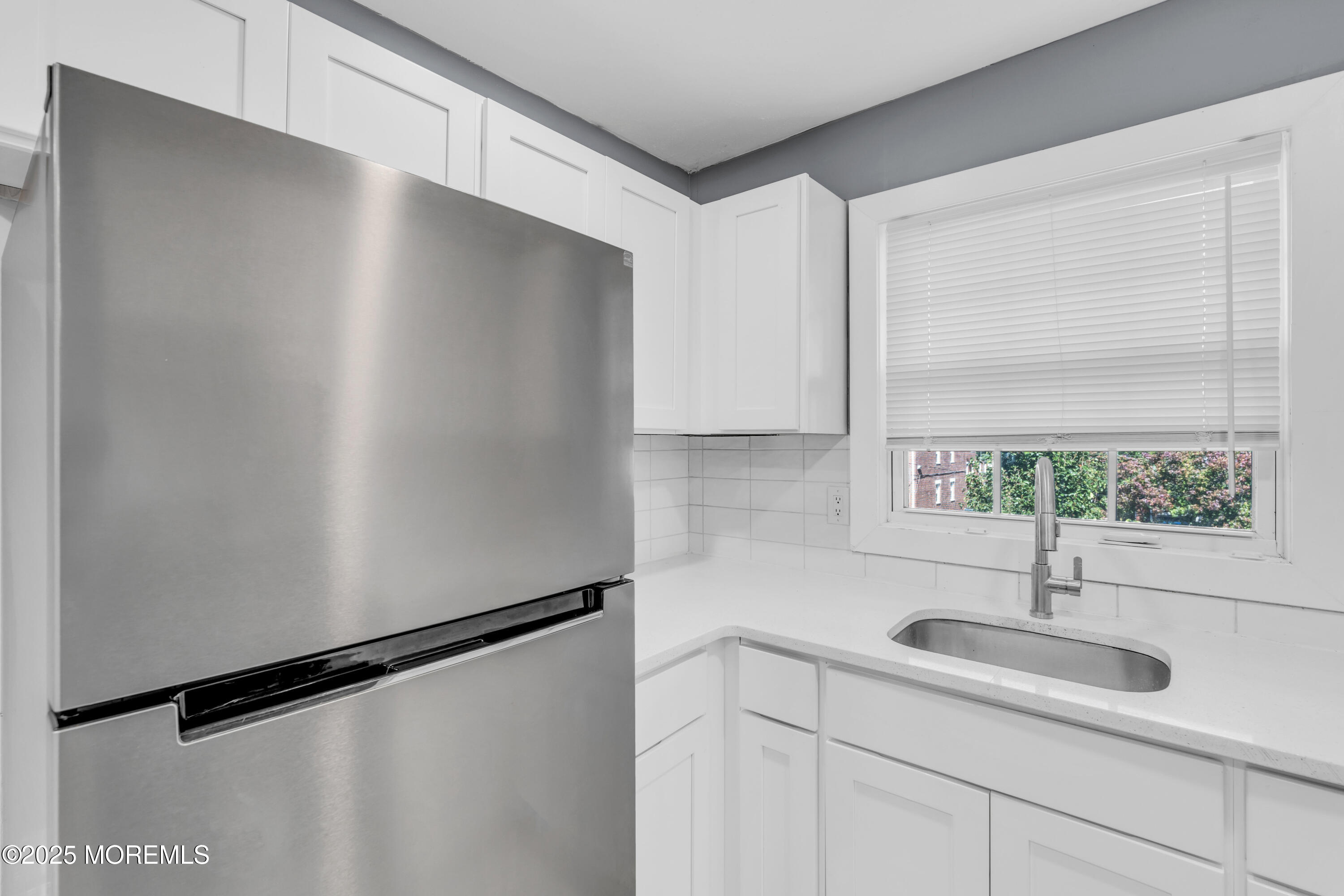 364 Westwood Avenue, Unit 83 Long Branch, NJ 07740 - Photo 16 of 17 a kitchen with a sink and a window