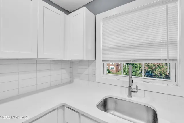 a kitchen with a sink and a window