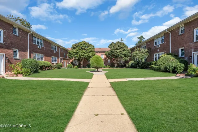a view of a building with a yard