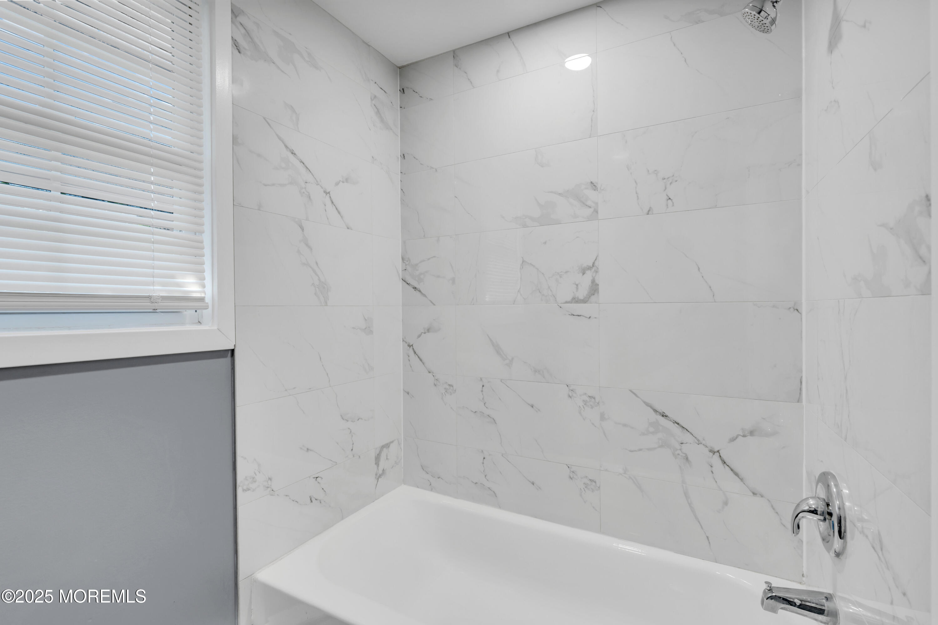 364 Westwood Avenue, Unit 83 Long Branch, NJ 07740 - Photo 6 of 17 a bathroom with a bathtub