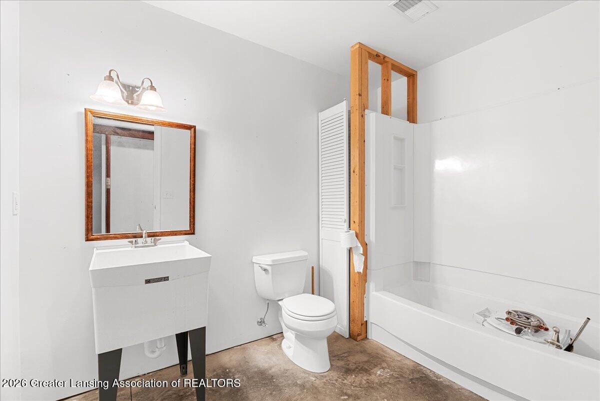 5859 Sleight Road Bath, MI 48808 - Photo 38 of 72 Basement Bathroom
