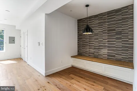 a view of a door and wooden floor