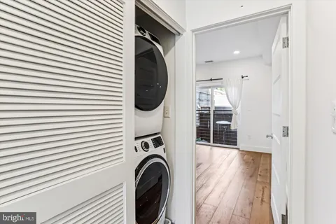 a view of a hallway with washer and dryer