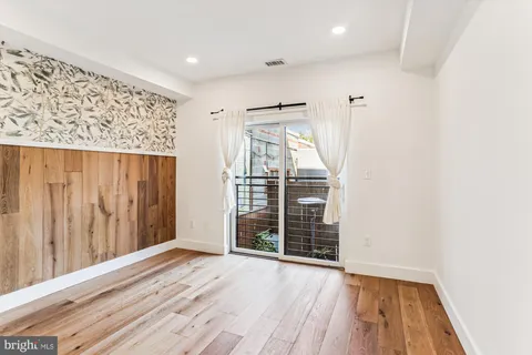 a bathroom with a shower and a bath tub