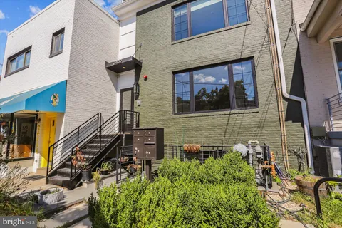 a view of a house with a tree