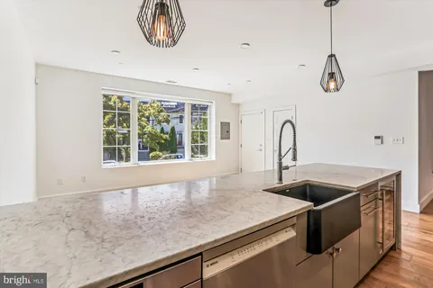 a kitchen with a sink and a window