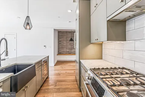 a kitchen with a stove and a sink