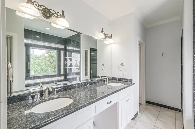 a bathroom with a bathtub and window