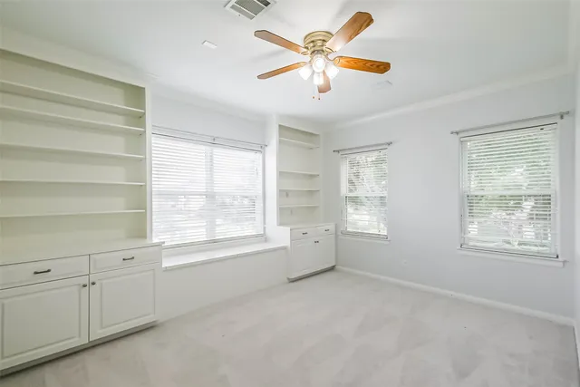 a bathroom with a granite countertop sink a mirror and shower