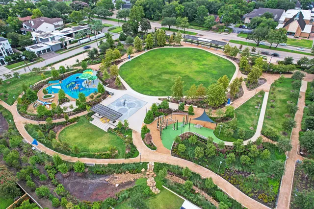 a view of house with a garden and a pathway