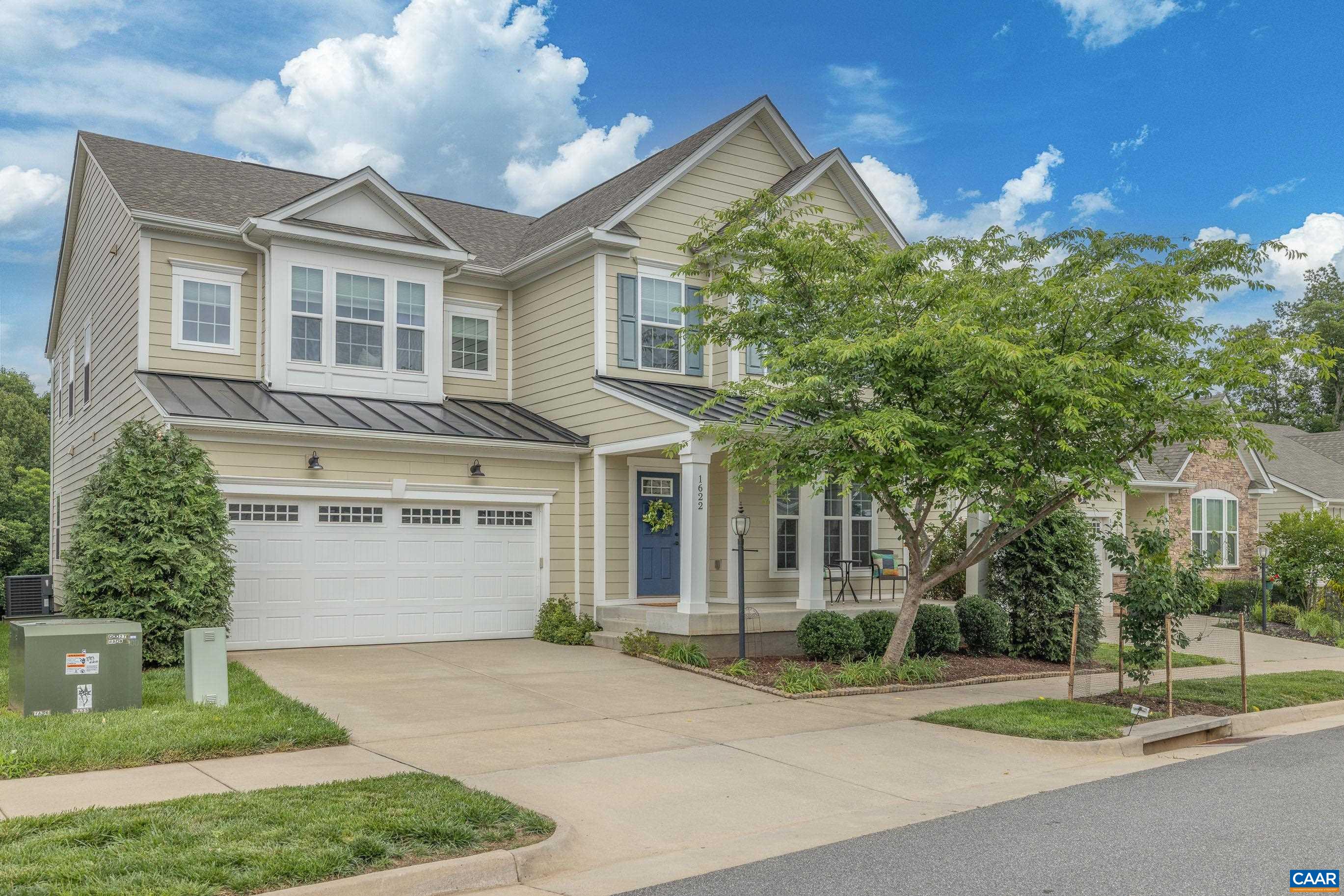 1622 Fowler Ridge Court Charlottesville, VA 22901 - Photo 1 of 75 a view of a white house with a yard and plants