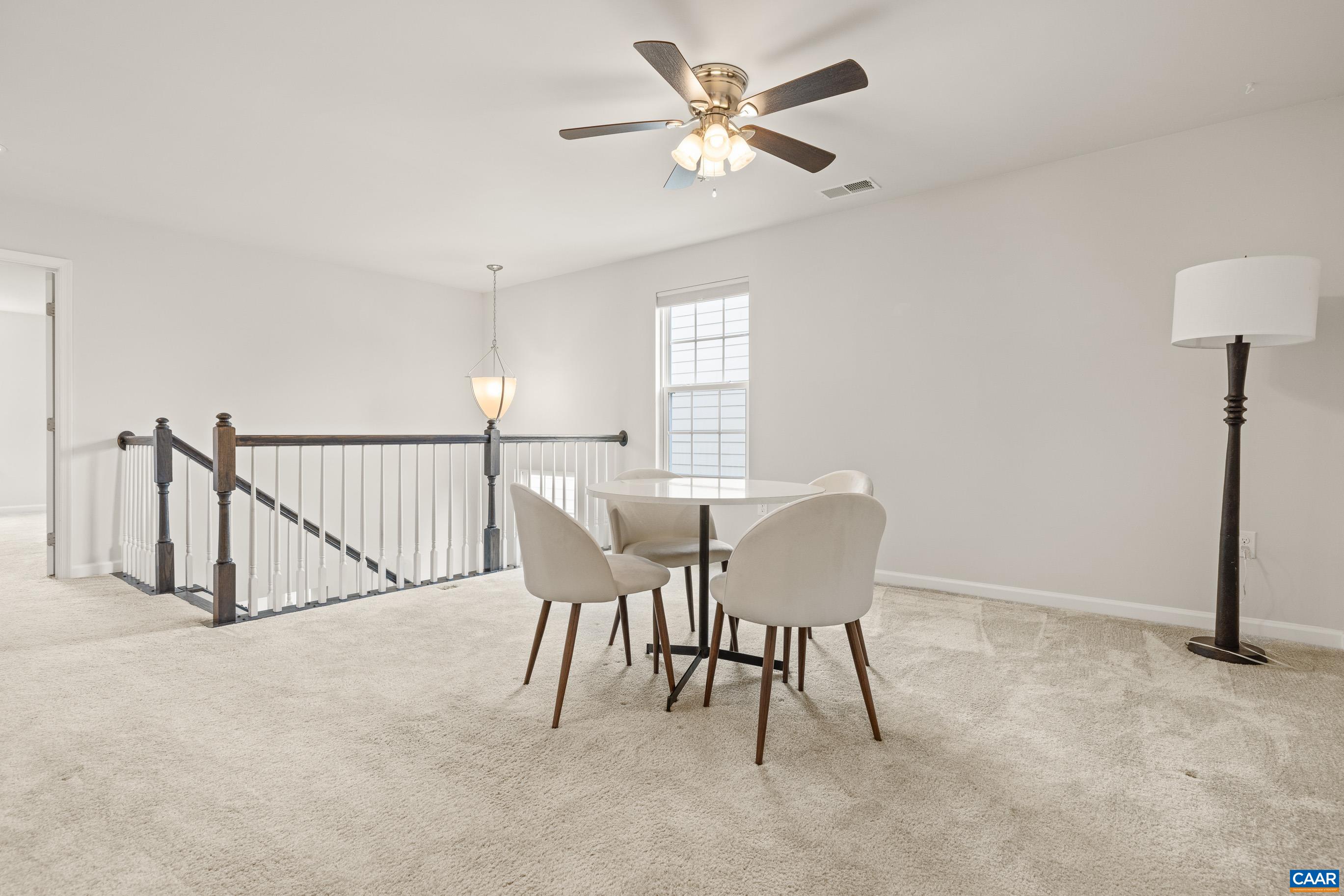 1622 Fowler Ridge Court Charlottesville, VA 22901 - Photo 54 of 75 a dining room with furniture and a chandelier fan