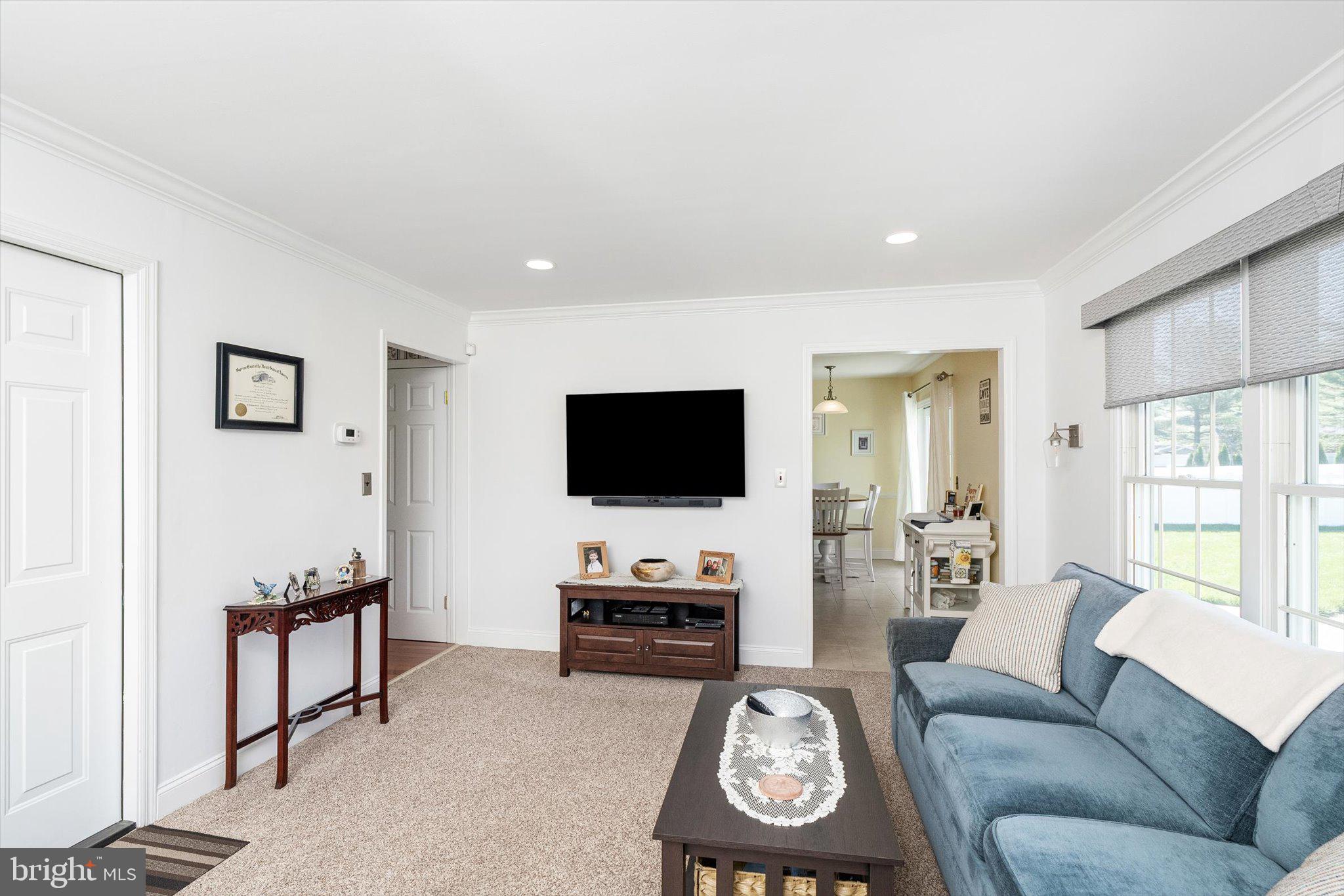 1111 Estates Boulevard Hamilton, NJ 08690 - Photo 16 of 47 a living room with furniture and a flat screen tv