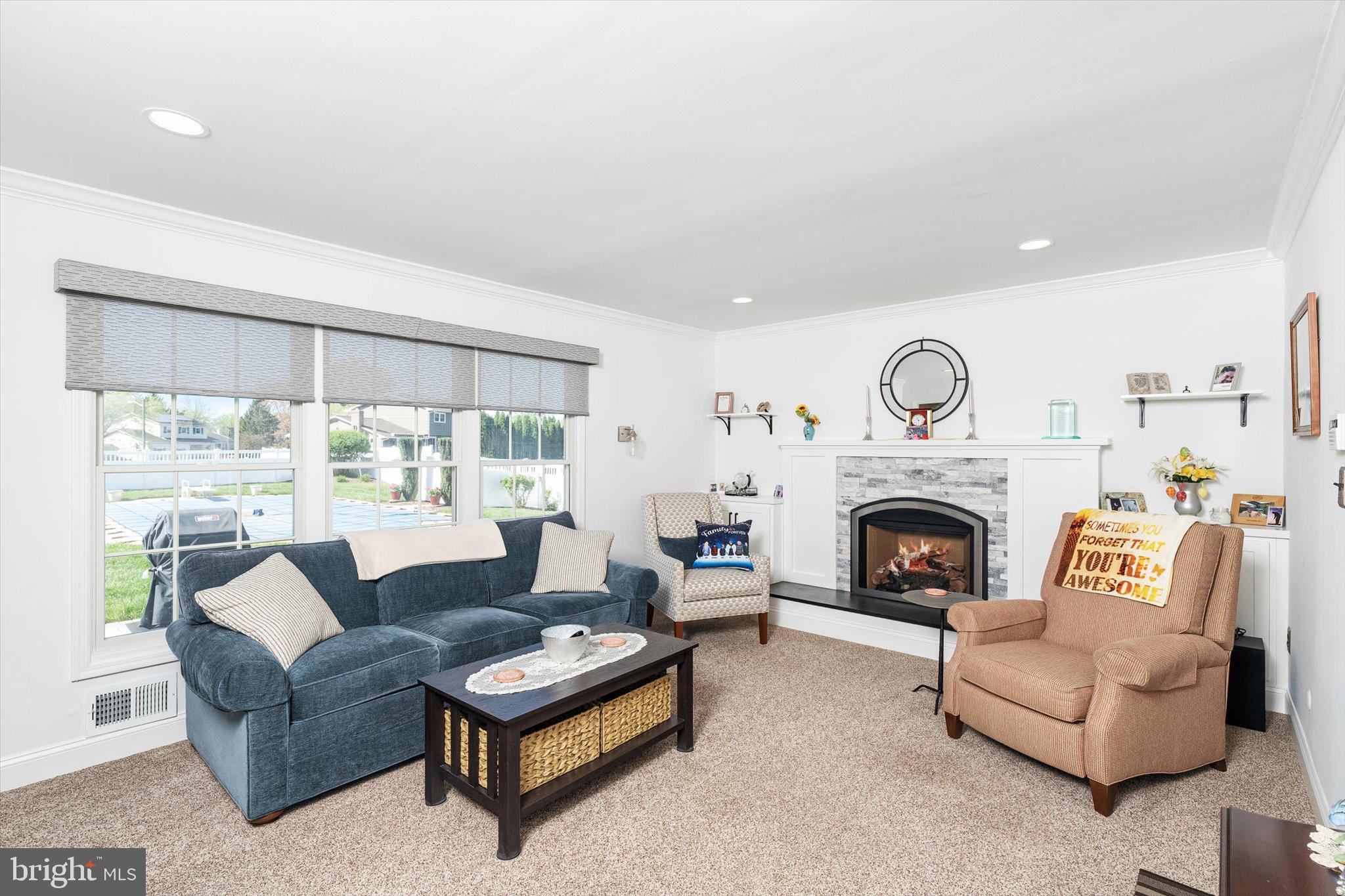 1111 Estates Boulevard Hamilton, NJ 08690 - Photo 17 of 47 a living room with furniture and a fireplace