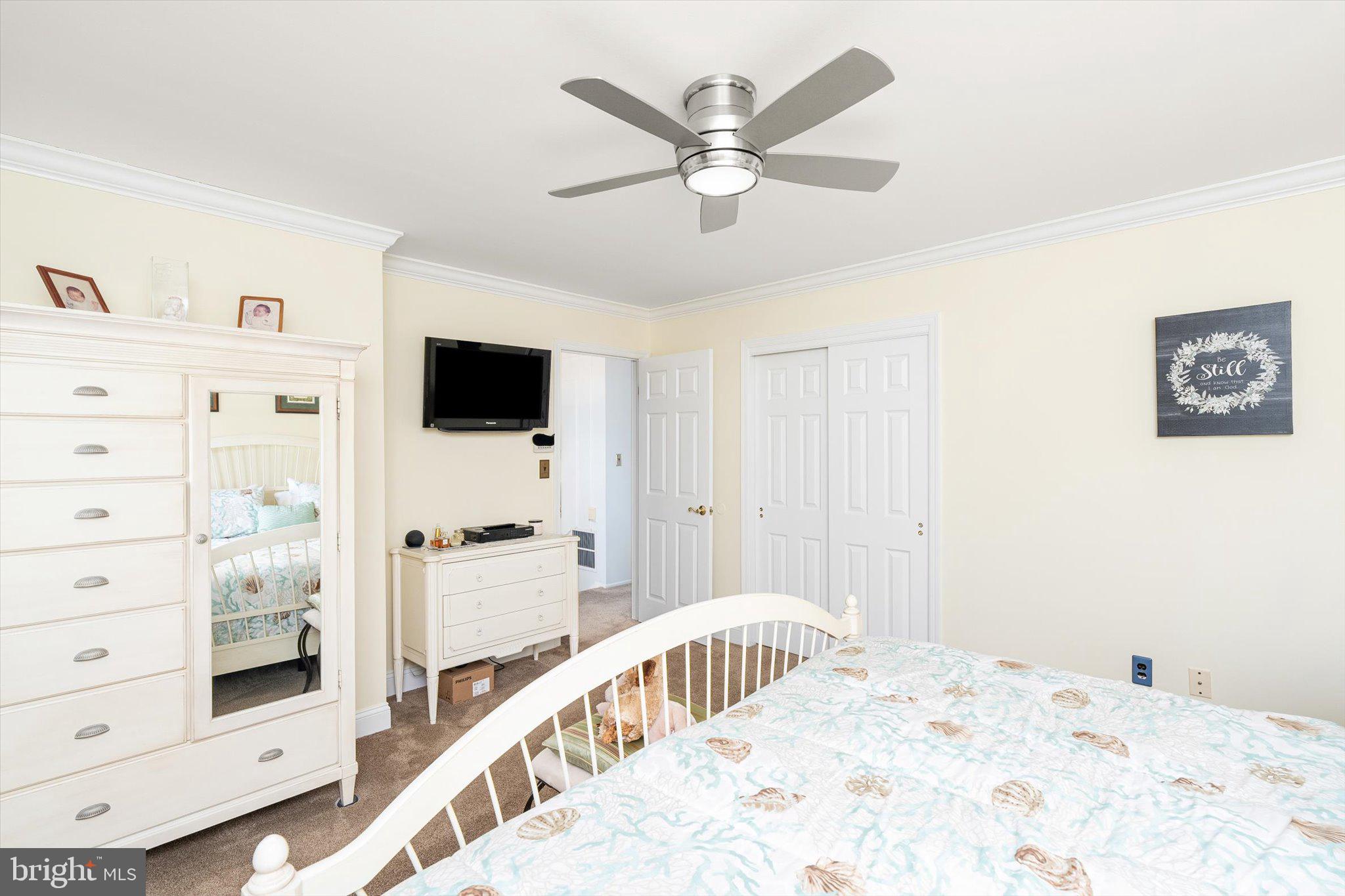 1111 Estates Boulevard Hamilton, NJ 08690 - Photo 25 of 47 a bedroom with a bed and a flat screen tv