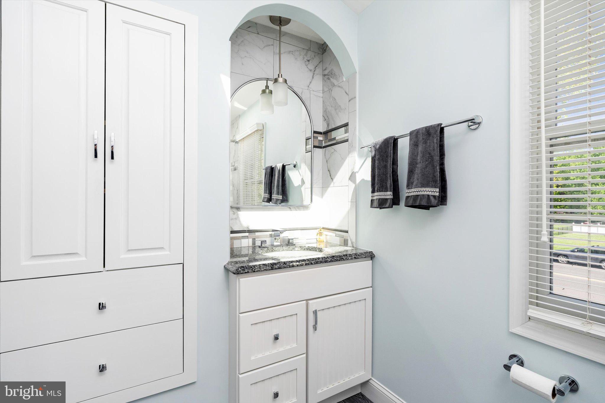1111 Estates Boulevard Hamilton, NJ 08690 - Photo 32 of 47 a bathroom with a sink and mirror