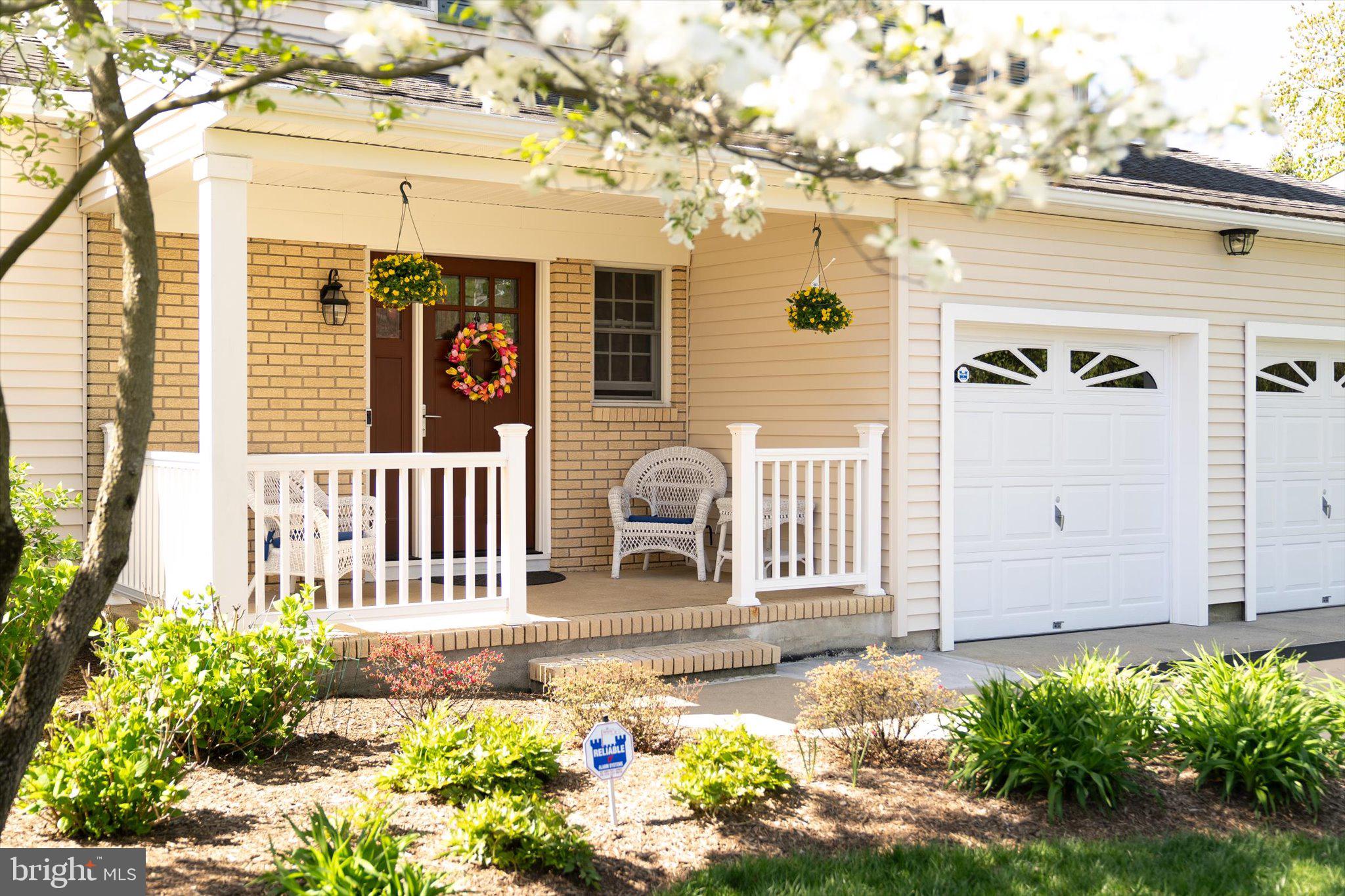 1111 Estates Boulevard Hamilton, NJ 08690 - Photo 4 of 47 a front view of a house with a yard