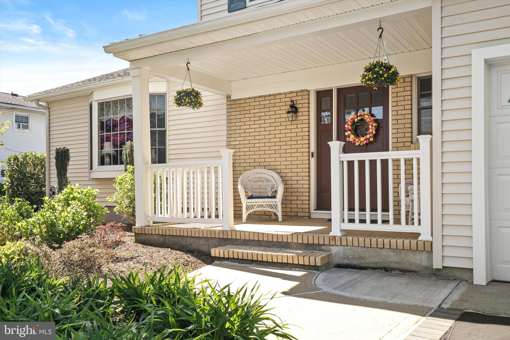 1111 Estates Boulevard Hamilton, NJ 08690 - Photo 5 of 47 a front view of a house with a porch