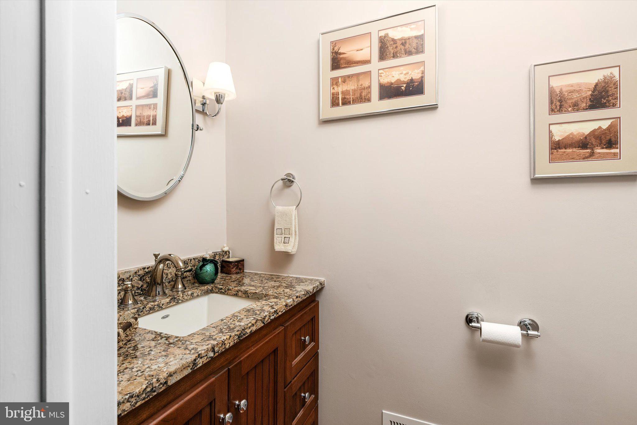 1111 Estates Boulevard Hamilton, NJ 08690 - Photo 7 of 47 a bathroom with a granite countertop sink and a mirror
