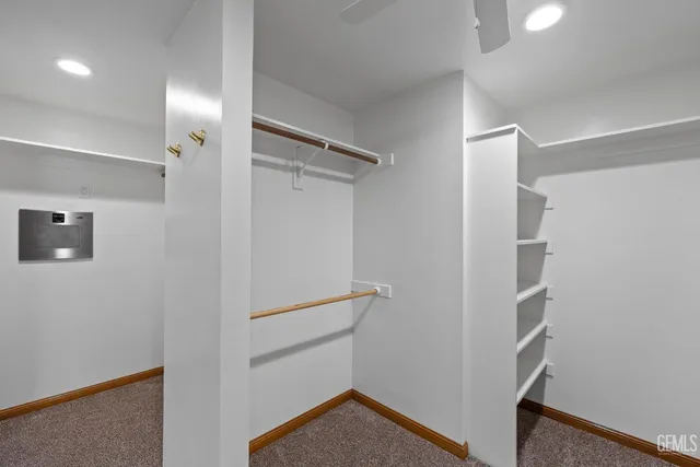 a spacious bathroom with a double vanity sink and a mirror