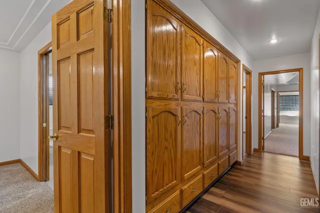 a view of a house with a big yard and a fountain