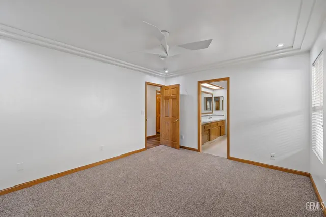an aerial view of residential house with outdoor space and trees all around