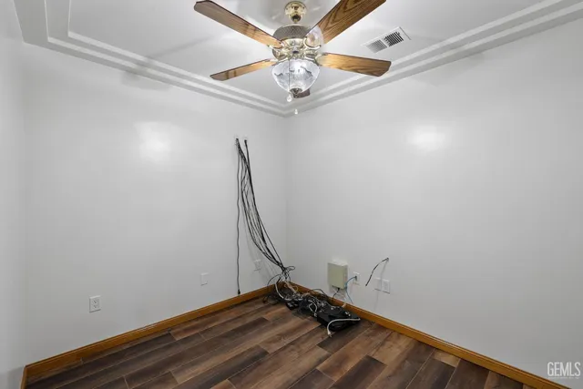 a street sign that is on a wooden wall