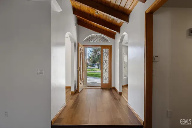 a view of a room with wooden floor