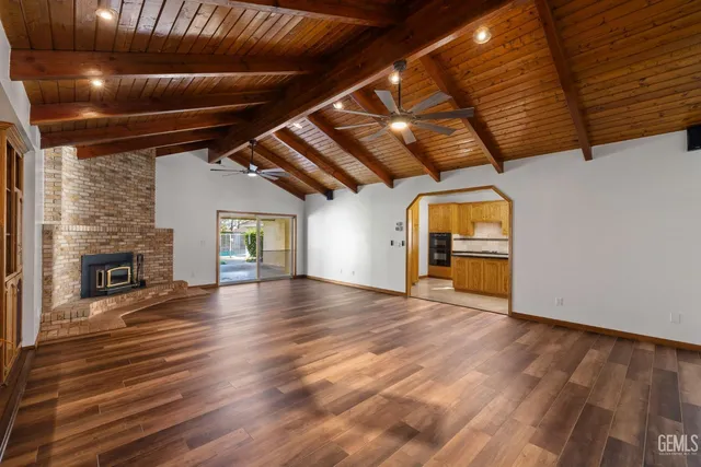 a view of a room with wooden floor