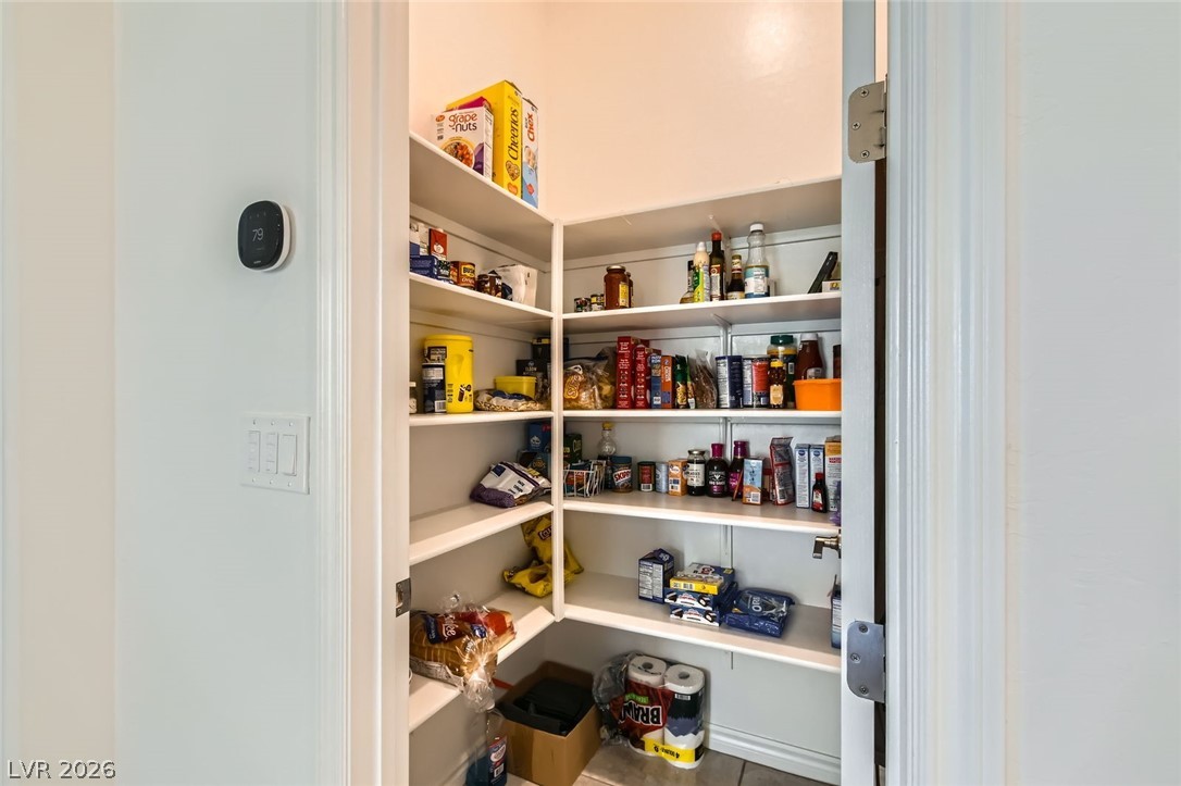 498 Pebble Run Avenue Henderson, NV 89011 - Photo 20 of 47 Organized and ready, this spacious pantry boasts generous shelving for all your culinary essentials.