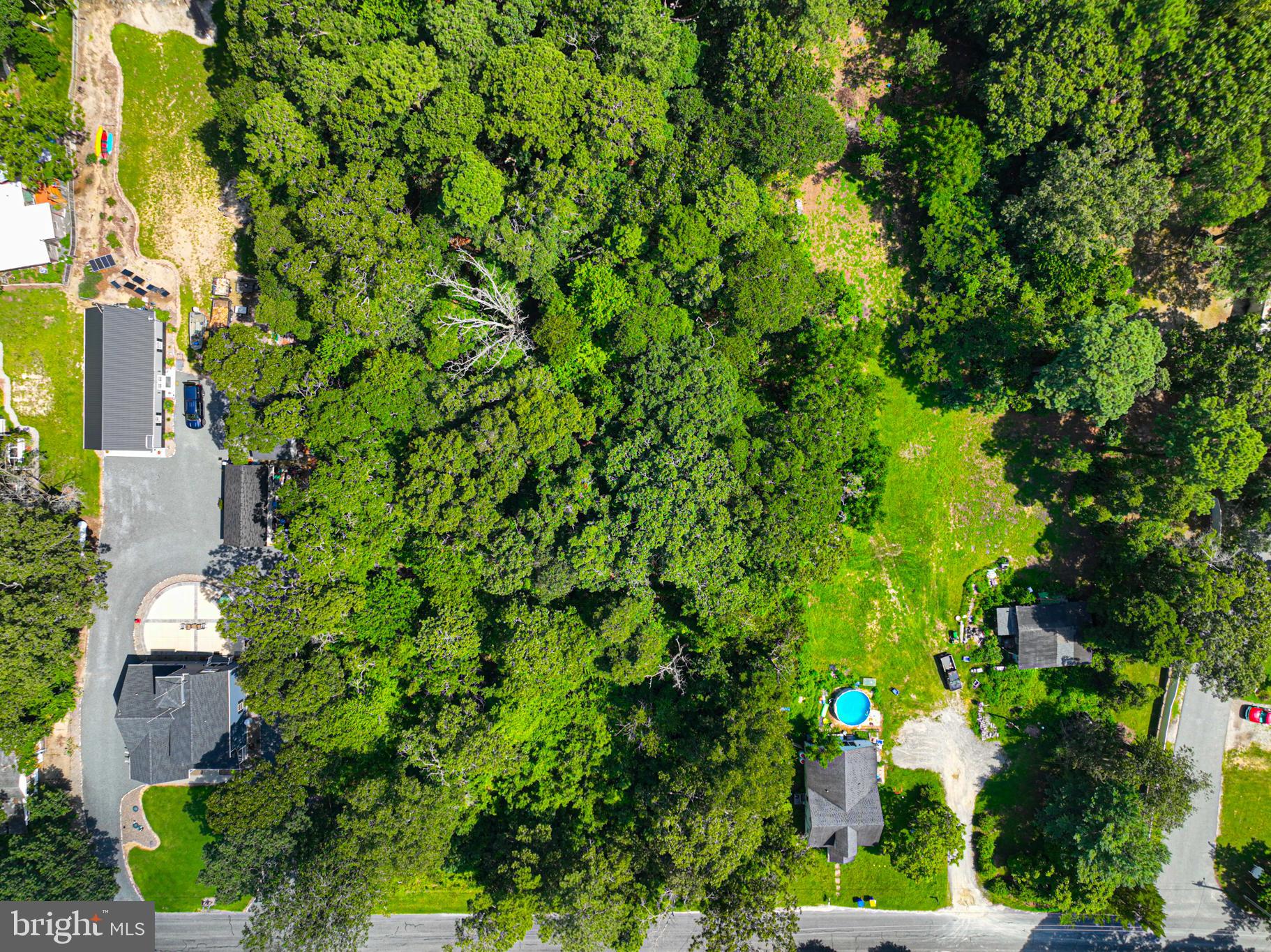 27892 Possum Point Road Millsboro, DE 19966 - Photo 21 of 21 an aerial view of a house with a yard