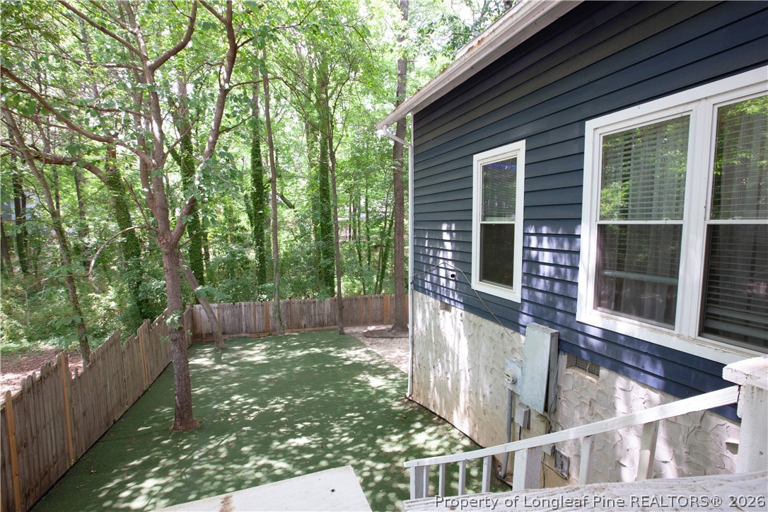 5948 Dalton Road Fayetteville, NC 28314 - Photo 4 of 18 a view of house with backyard and outdoor seating