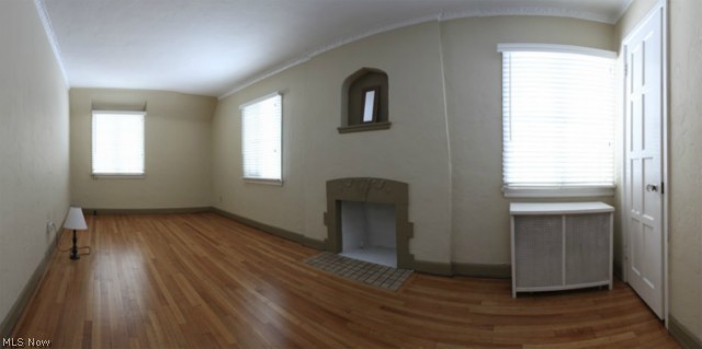 3712 Traynham Road Beachwood, OH 44122 - Photo 15 of 25 The master bedroom features a decorative fireplace (not wood burning) & niche, refinished wood floors, crown molding & radiator cover.