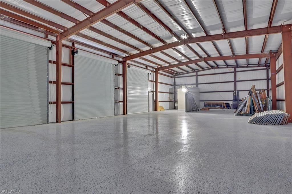 730 29th Street Southwest Naples, FL 34117 - Photo 6 of 50 Garage featuring metal wall