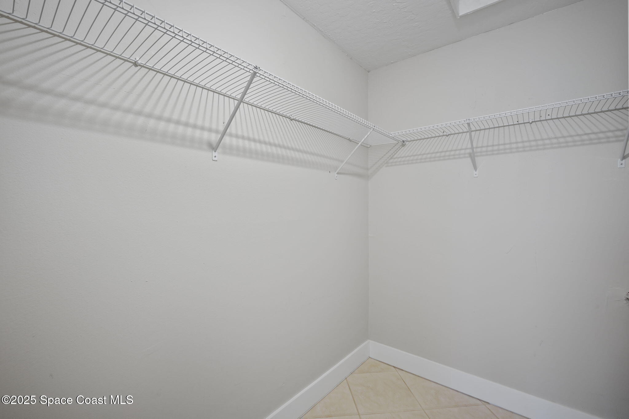 201 Cocoa Isles Boulevard, Unit 3 Cocoa Beach, FL 32931 - Photo 13 of 21 Walk-in closet