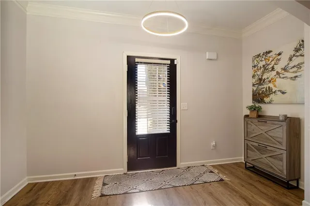a view of a room with wooden floor and cabinet