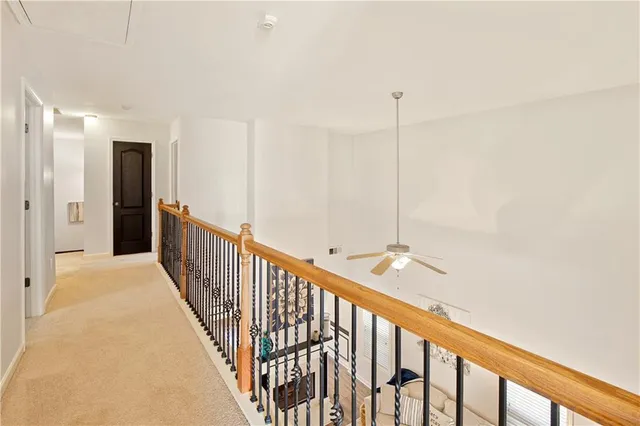 a view of a hallway with windows