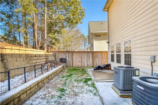 a view of a backyard with sitting area