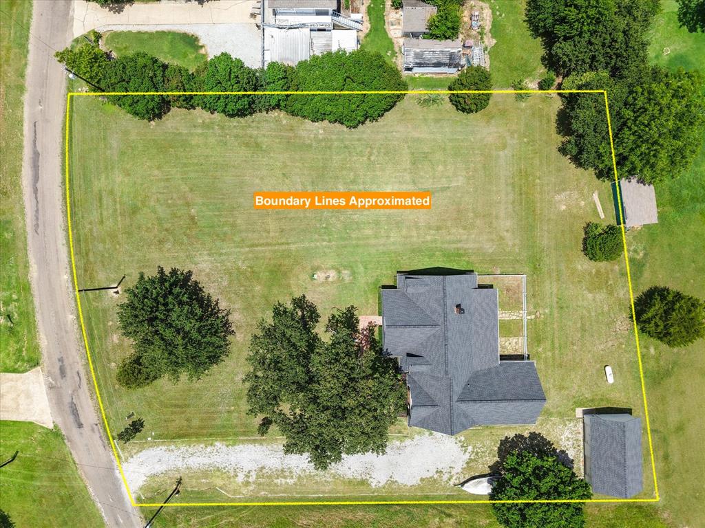 13021 Rudy's Way Streetman, TX 75859 - Photo 31 of 40 Aerial view near Dallas highlighting the 1-acre lot, home placement, driveway, and detached garage or storage building.