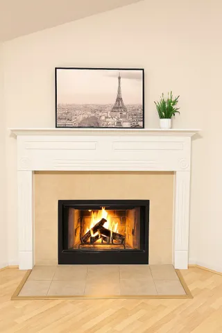 a view of fireplace with wooden floor
