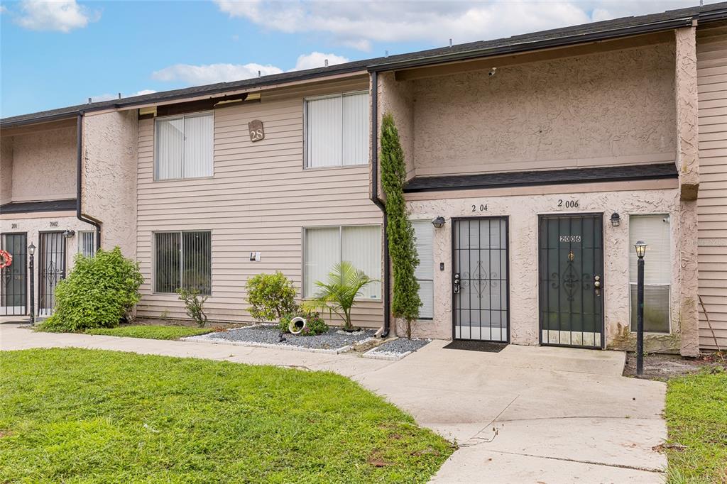 front view of a house with a yard