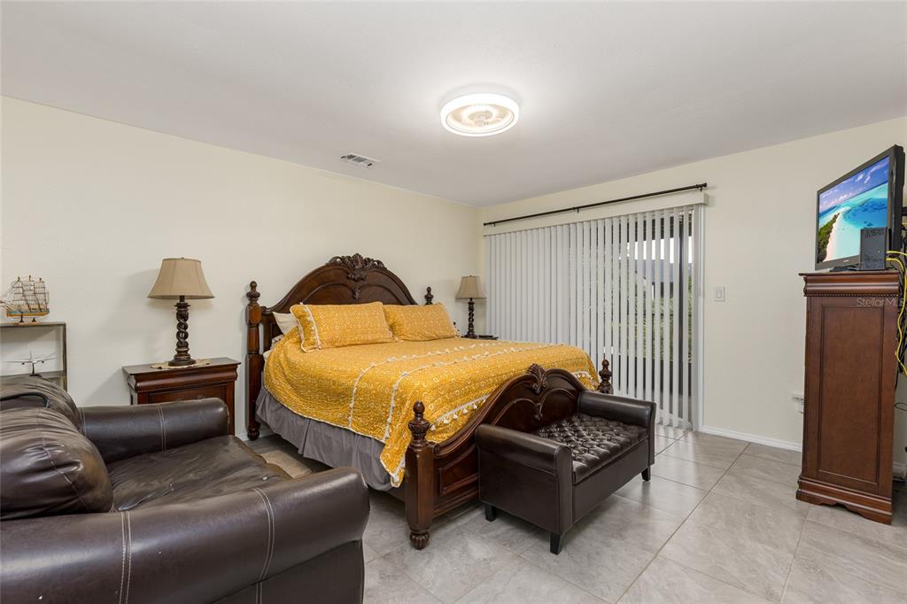 2004 Ludlow Lane, Unit 2803 Orlando, FL 32839 - Photo 16 of 31 a bedroom with a bed and a couch